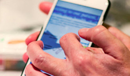 Hand pointing at phone